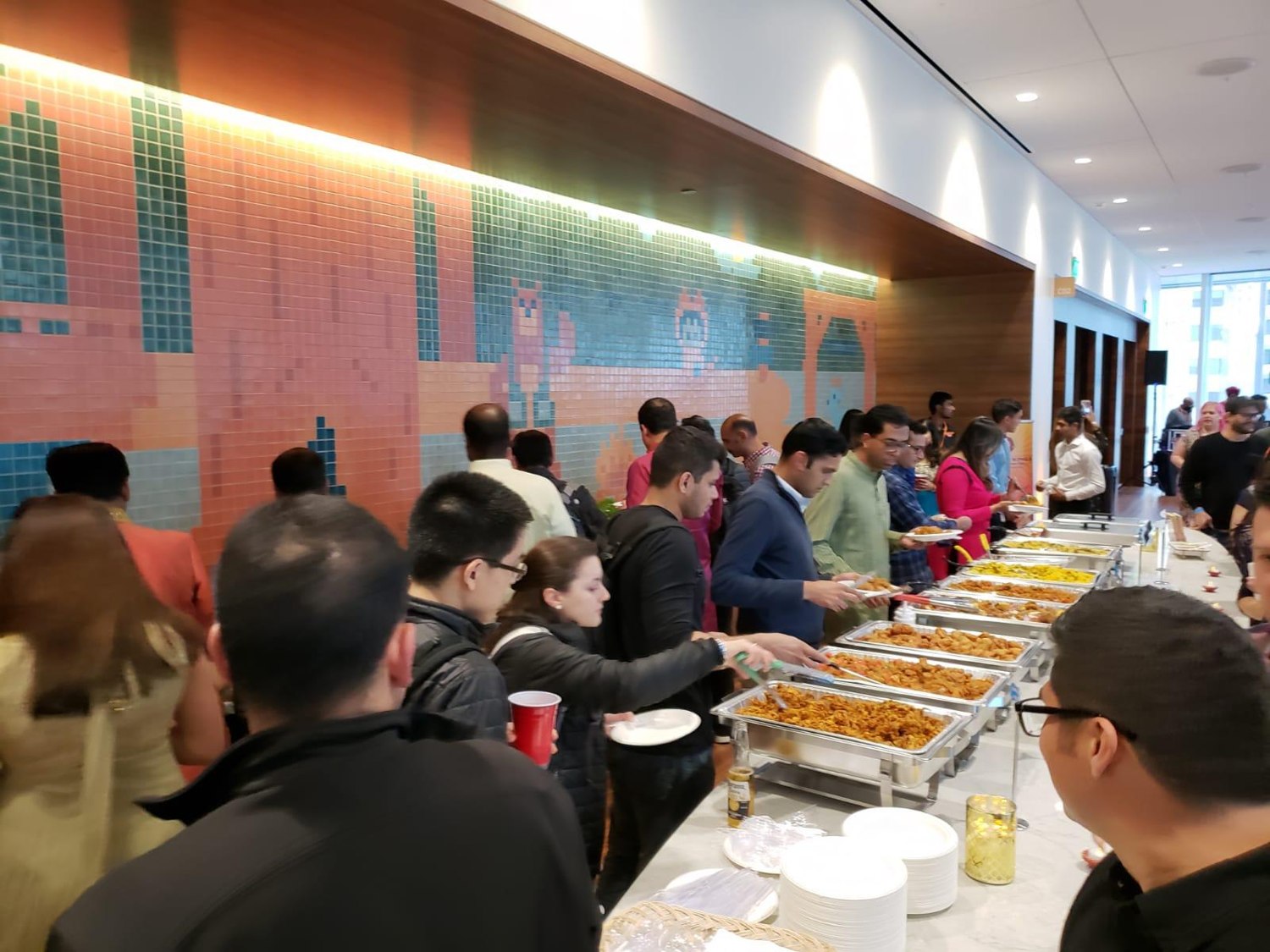 Guests enjoying the South Indian buffet at the Salesforce event catered by Chennai Kings